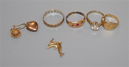 An 18ct gold signet ring, a 15ct gold and ruby gypsy-set ring (lacking one stone) and five other items,